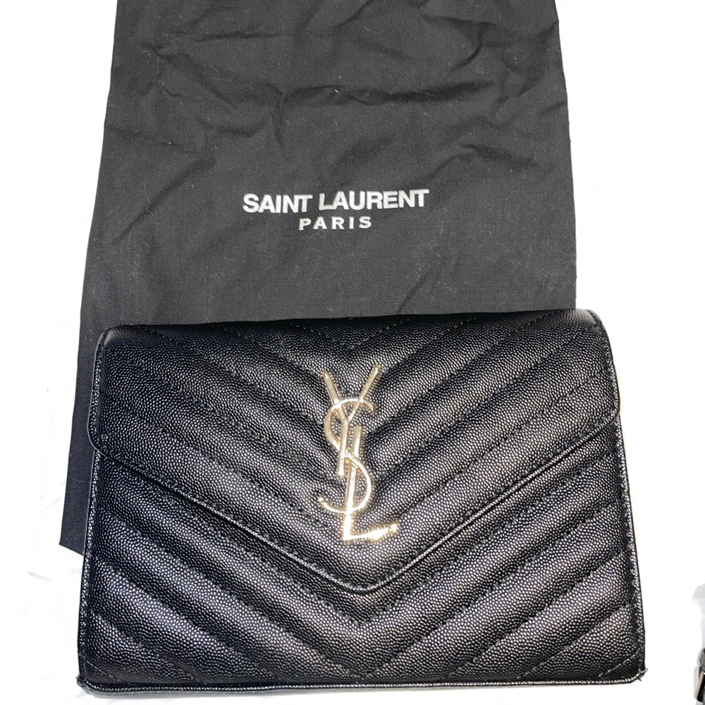 Black Shoulder Bag to Clutch w/ Gold Chain—YSL Logo in Gold.